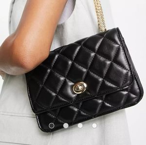 ASOS DESIGN diamond quilted crossbody bag with lock detail and adjustable